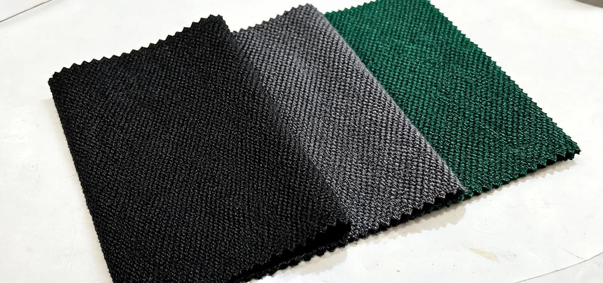 Layered performance fabric swatches prepared for specification review